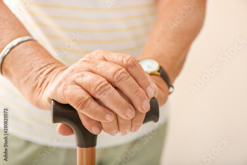 Elderly woman with walking ...