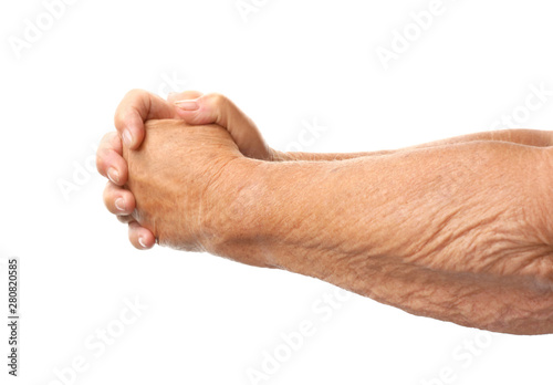 Hands of elderly woman on white background