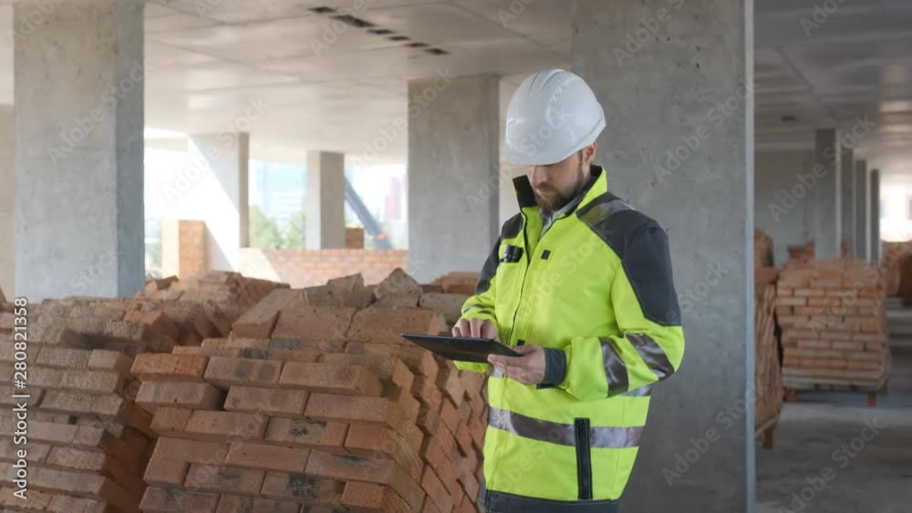 Architect or engineer working, browsing building project indoor of construction site with blueprint plan. businessman worker, man male construction engineers or architects working people. Engineer In