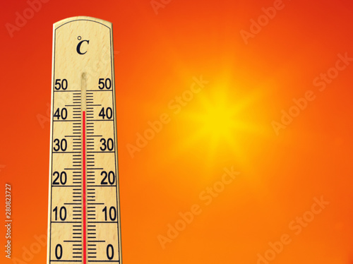Yellow sun in red sky. Summer heat. Thermometer shows high temperature in summer. Ambient temperature plus 43 degrees