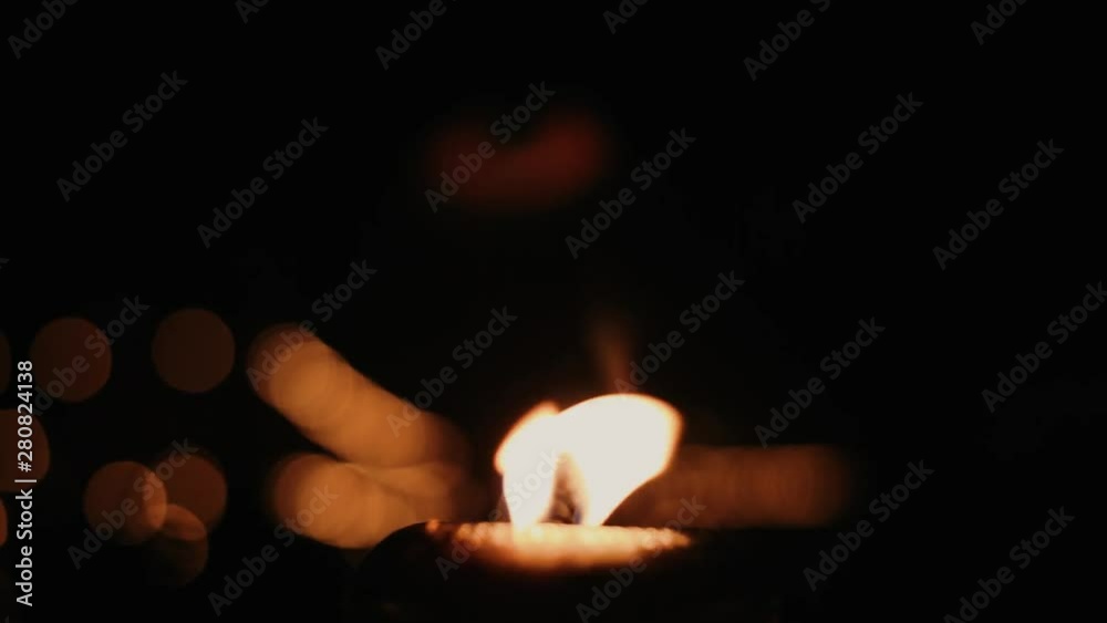Close up one Candle light burning in the dark Close up one Candle light burning in the dark