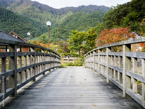 Wooden bridge and mountain scenery at Lake Saiko - Fuji Five Lakes, Japan