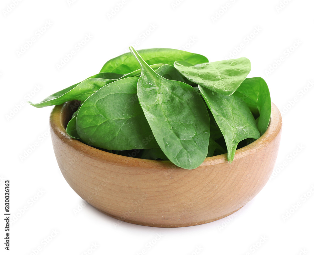 Fresh green healthy baby spinach leaves in wooden bowl isolated on white Fresh green healthy baby spinach leaves in wooden bowl isolated on white