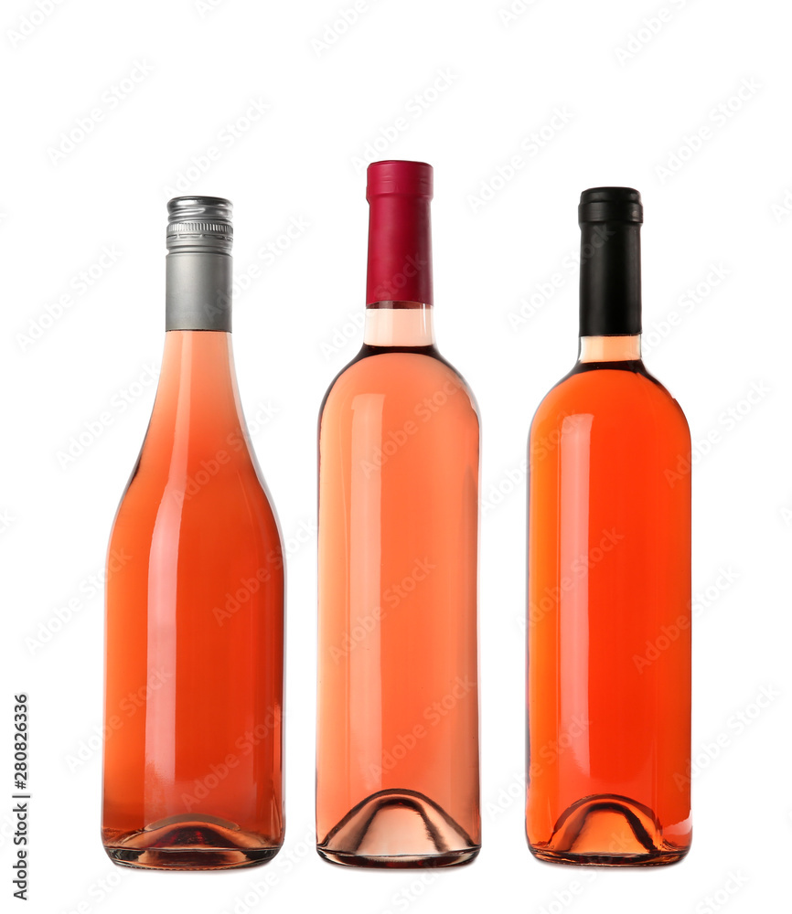 Bottles of delicious rose wine on white background. Mockup for design Bottles of delicious rose wine on white background. Mockup for design