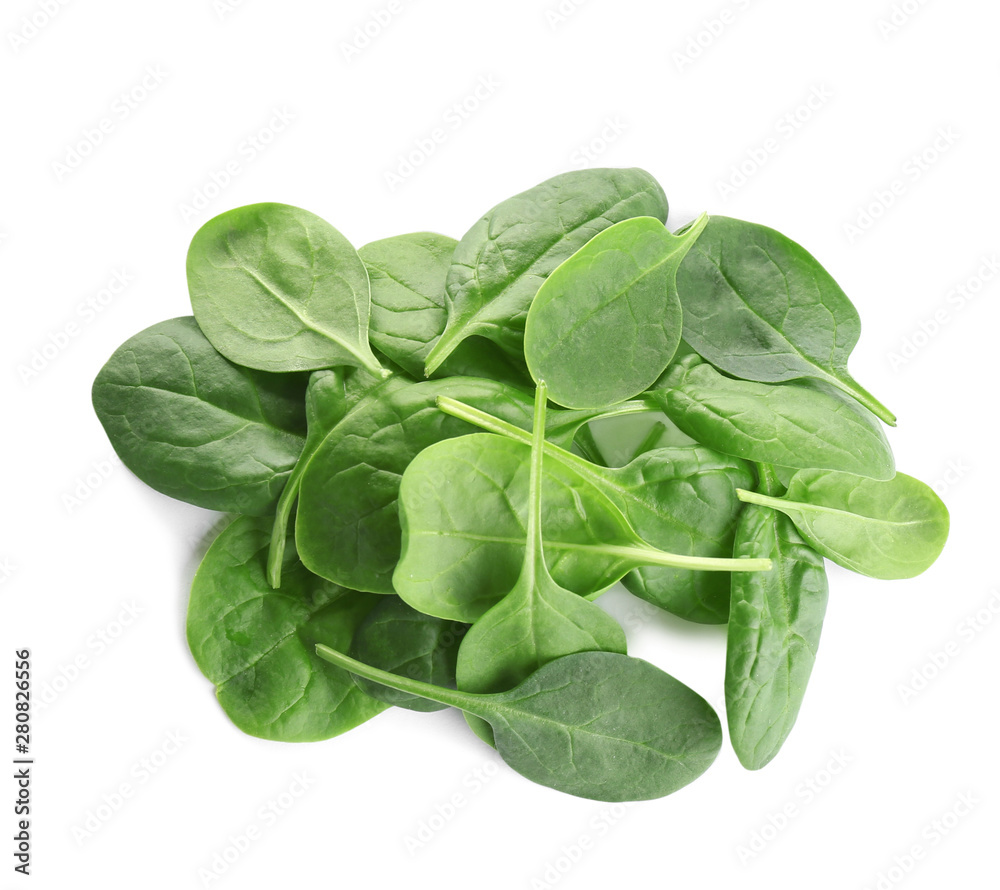 Pile of fresh green healthy baby spinach leaves on white background, top view Pile of fresh green healthy baby spinach leaves on white background, top view