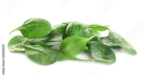 Pile of fresh green healthy baby spinach leaves on white background