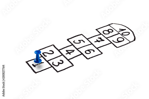 hopscotch game, player at the start, the concept of the beginning of a career, the beginning of movement and growth 