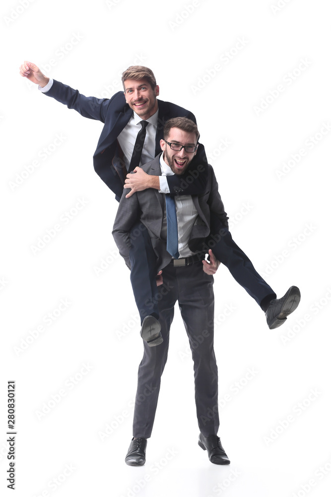 happy businessman carrying his colleague on the piggyback happy businessman carrying his colleague on the piggyback