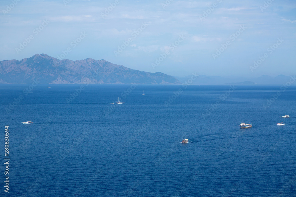 blue sea sailing ships with tourists in the summer