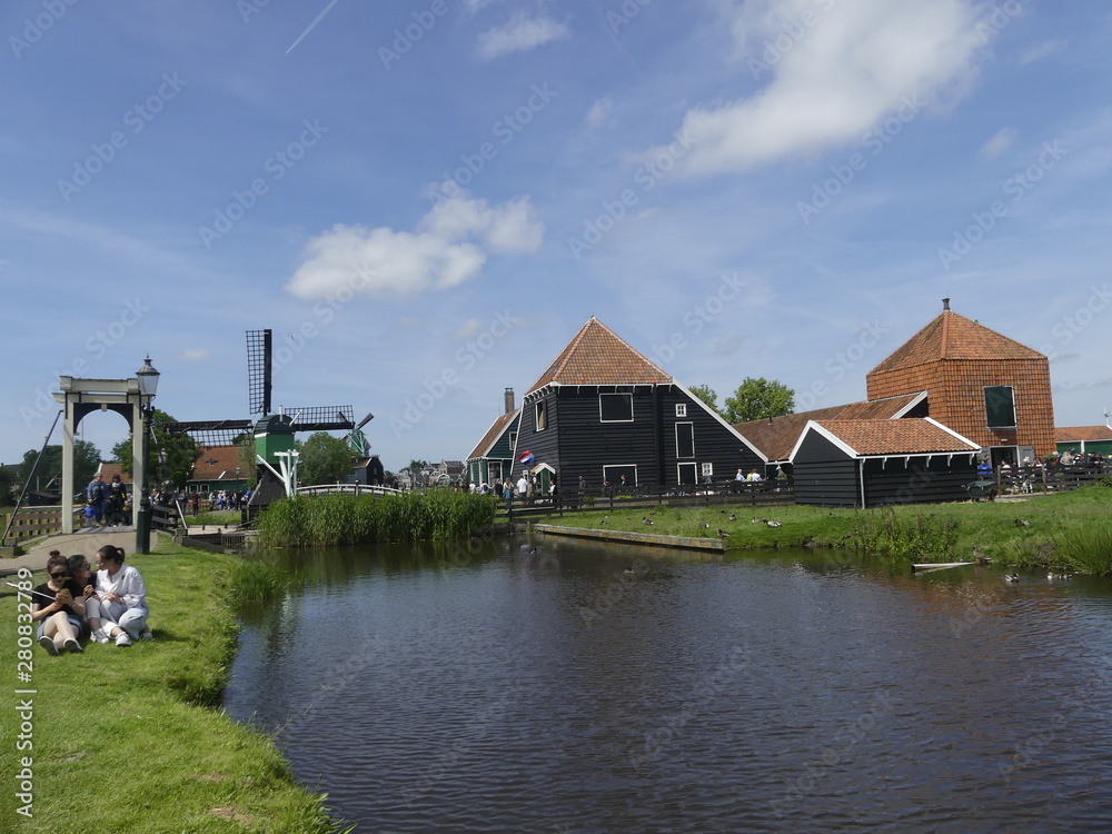  Windmills by the water. Authentic town. The old town in Holland.