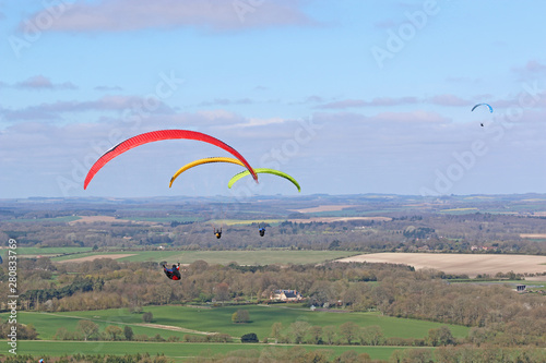 Paragliders flying at Combe Gibbet, England