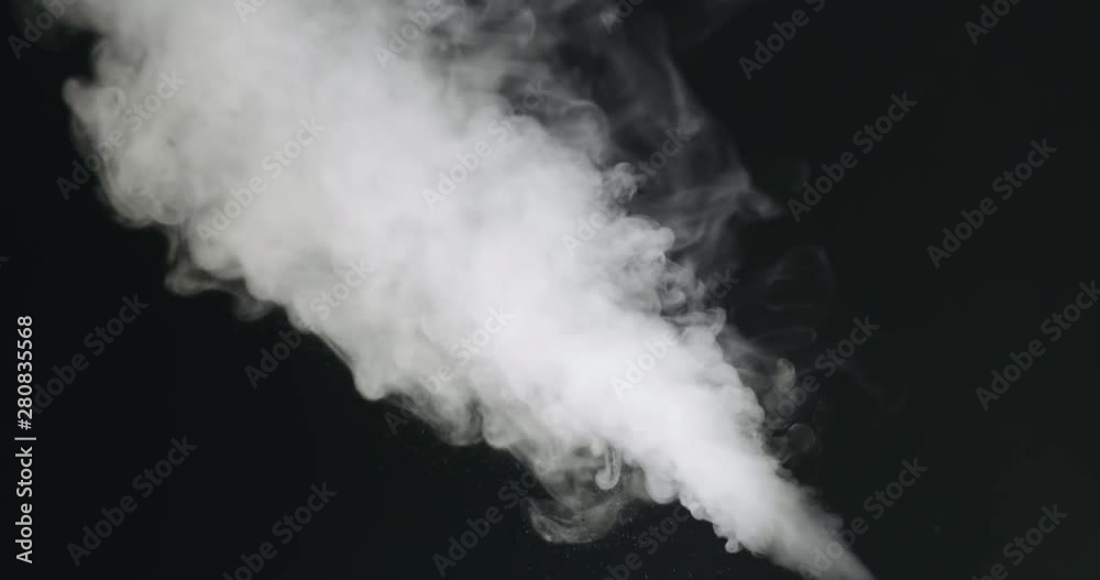 Slow motion of water vapor stream comes from below over black background Slow motion of water vapor stream comes from below over black background