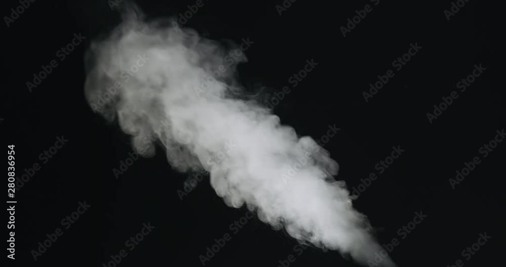 Slow motion of water vapor stream comes from below over black background