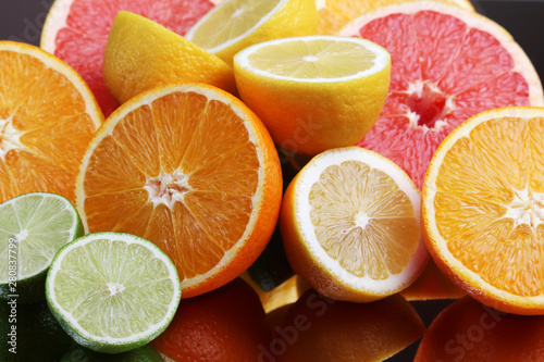 Fototapeta Naklejka Na Ścianę i Meble -  Mix of citrus fruits cut in different forms	