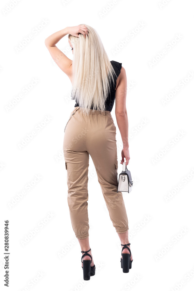 Back view of sexy blonde woman waiting and touching straight long hair. Full body isolated on white background. Back view of sexy blonde woman waiting and touching straight long hair. Full body isolated on white background.