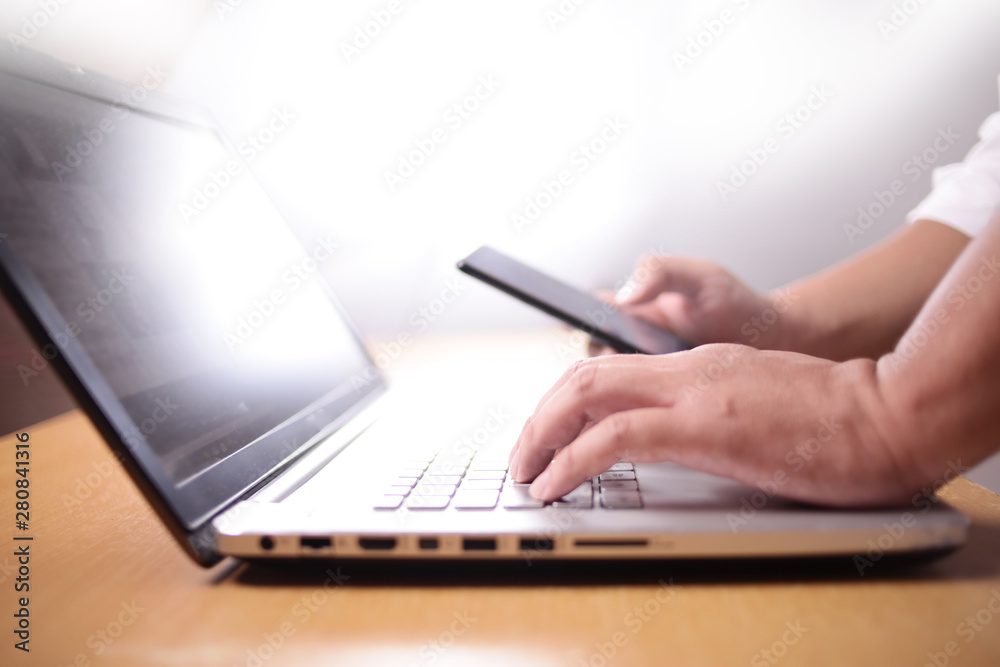 Businessman Using Smart Phone and Laptop Businessman Using Smart Phone and Laptop