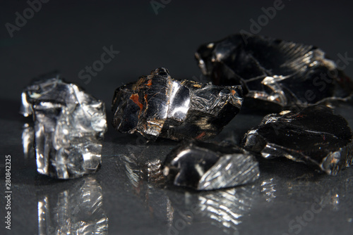 Shungit is a black rock that consists mainly of carbon and was photographed in top quality and studio quality.