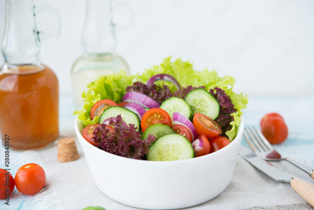 Summer vegetable salad with seasonal vegetables on rustic wooden background. Summer vegetable salad with seasonal vegetables on rustic wooden background.