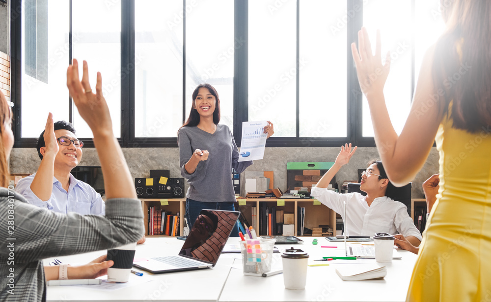 Group of business people raise hands up to agree with speaker in the meeting room seminar Group of business people raise hands up to agree with speaker in the meeting room seminar