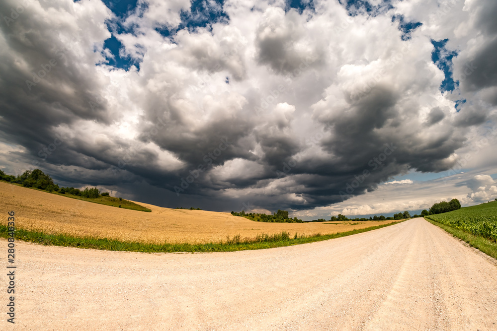 hdr panorama on asphalt road among fields in evening with awesome black clouds before storm hdr panorama on asphalt road among fields in evening with awesome black clouds before storm
