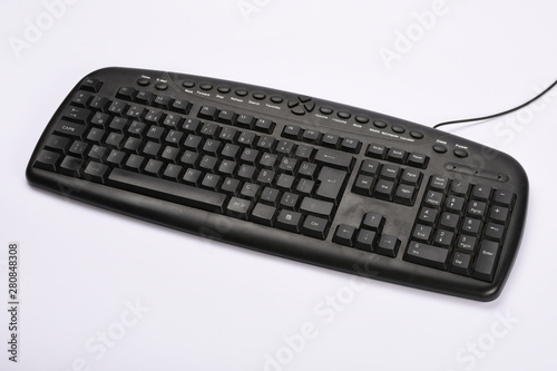 Old computer keyboard isolated on white