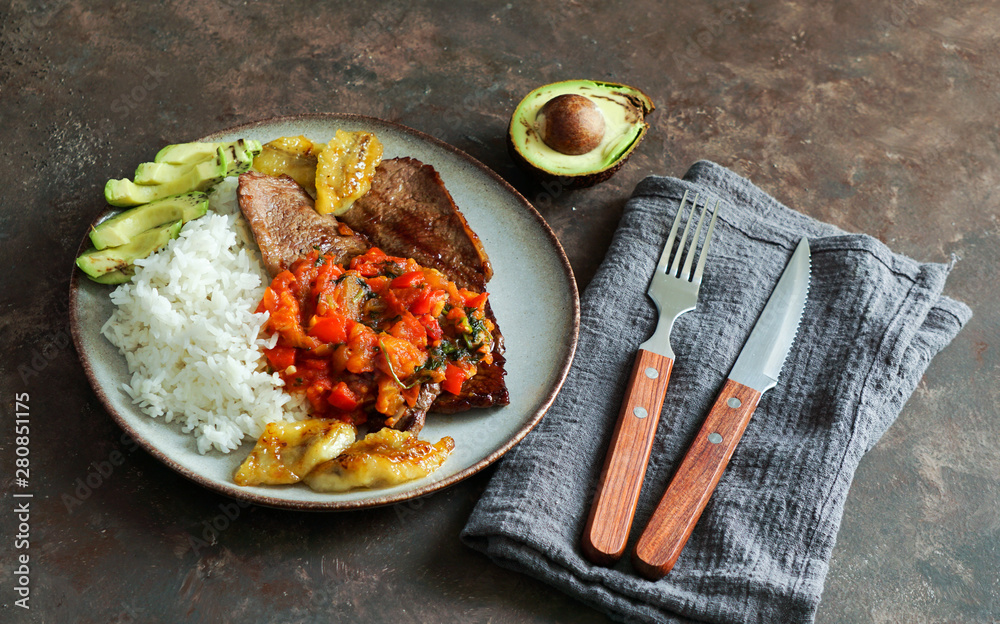 colombian food. El Bistec a la Criolla traditional beef steak with