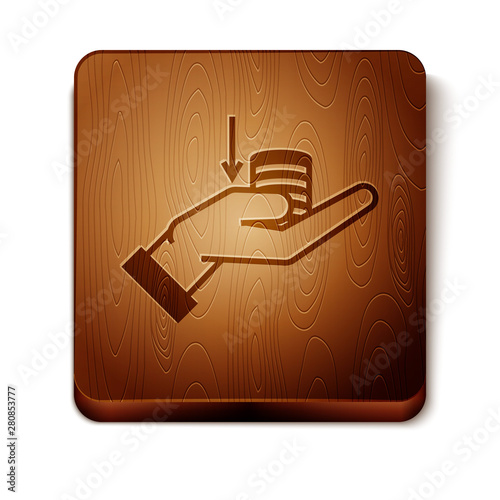 Brown Money on hand icon isolated on white background. Palm holds cash with down. Cash salary decrease. Wooden square button. Vector Illustration