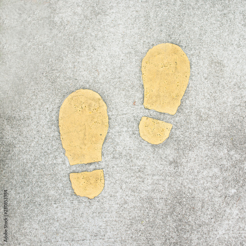 Footprint painted on the pavement, footpath, sidewalk