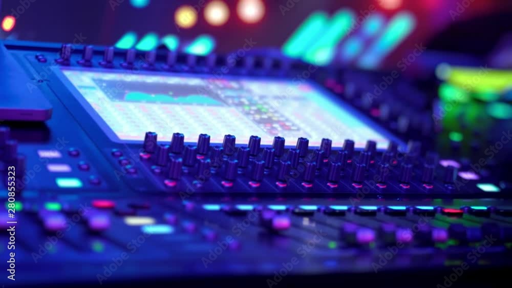 Remote control for adjusting the sound. Audio mixer. Sound engineer adjusts the sound. Music Festival. Change the volume level. Recording studio. Shooting a television show, a concert. Live broadcast. Remote control for adjusting the sound. Audio mixer. Sound engineer adjusts the sound. Music Festival. Change the volume level. Recording studio. Shooting a television show, a concert. Live broadcast.