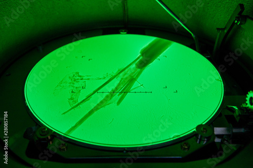 Environmental laboratory, tremolite fibers (asbestos variety) seen on the fluorescent screen of a transmission electron microscope, 15000 times magnification photo