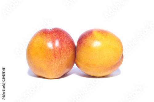 Exotic fruits on white background. Nectarine peaches.