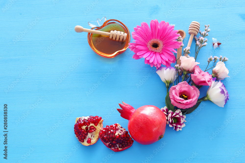Naklejka premium religion image of Rosh hashanah (jewish New Year holiday) concept. Traditional symbols over wooden blue background