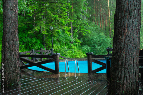 blue pool in green forest