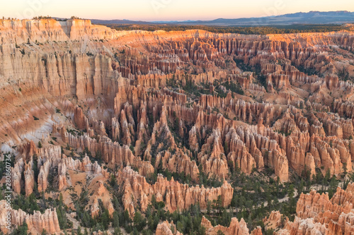 The stunning Bryce Canyon in all its glory at sunrise, amazing limetstone hoodoo with various shades of oranges and reds.