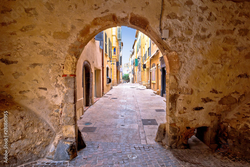 Saint Tropez historic town gate and colorful street view