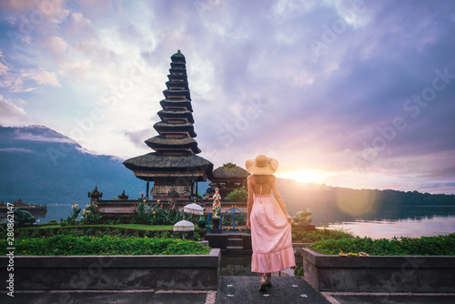 Beautiful girl visiting the ulun danu bratan temple in Bali. Concept about exotic lifestyle wanderlust traveling
