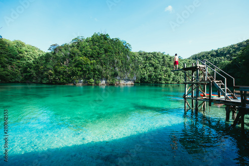 Man meditate at the lagoon in the morning  enjoying the view. Shot at the sugba bay in Siargao philippines