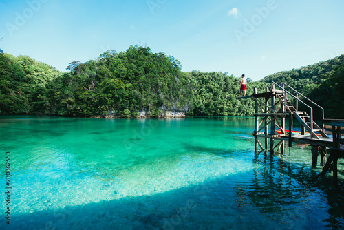 Man meditate at the lagoon in the morning, enjoying the view. Shot at the sugba bay in Siargao,philippines photo