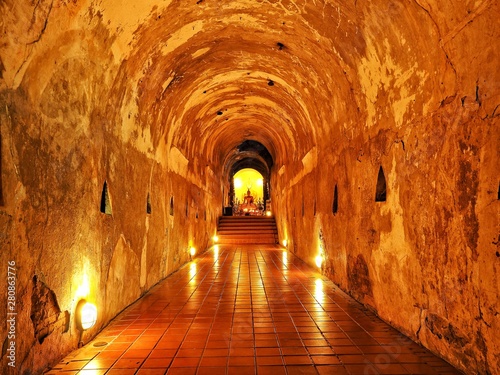 Stone Buddha image in the canal decorated with light.      