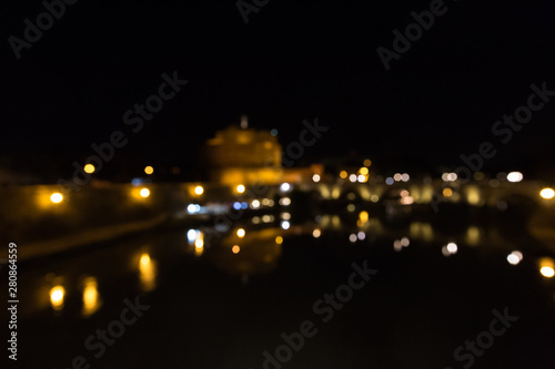Blur night view of The Mausoleum of Hadrian, known as the Castel Sant Angelo in Rome, Italy.