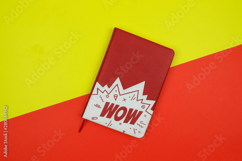 notebook on a yellow and red background