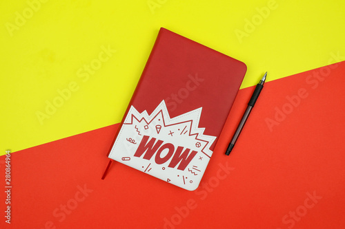 notebook on a yellow and red background