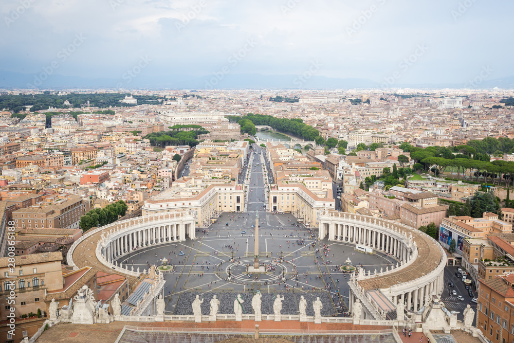 View from the dome of the cathedral at Saint Peter's Square in Vatican and aerial panorama of Rome
