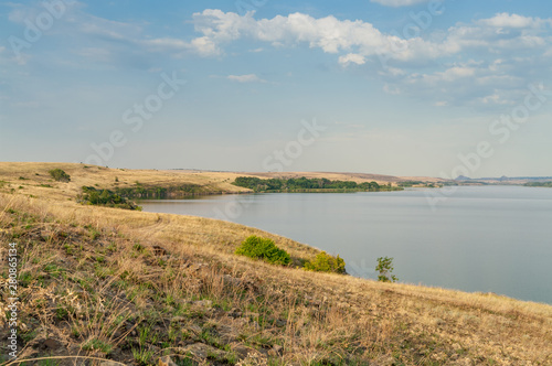 Eastern European steppe landscape with reservoir. End of summer. Landscape park  Donbass.