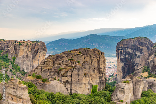 Fototapeta Naklejka Na Ścianę i Meble -  Wonderful view of the rocks and monasteries of Meteora, Greece. Mysterious Sunny evening with colorful sky, during sunset. Awesome Nature Landscape. Amazing Greece. Popular travel locations