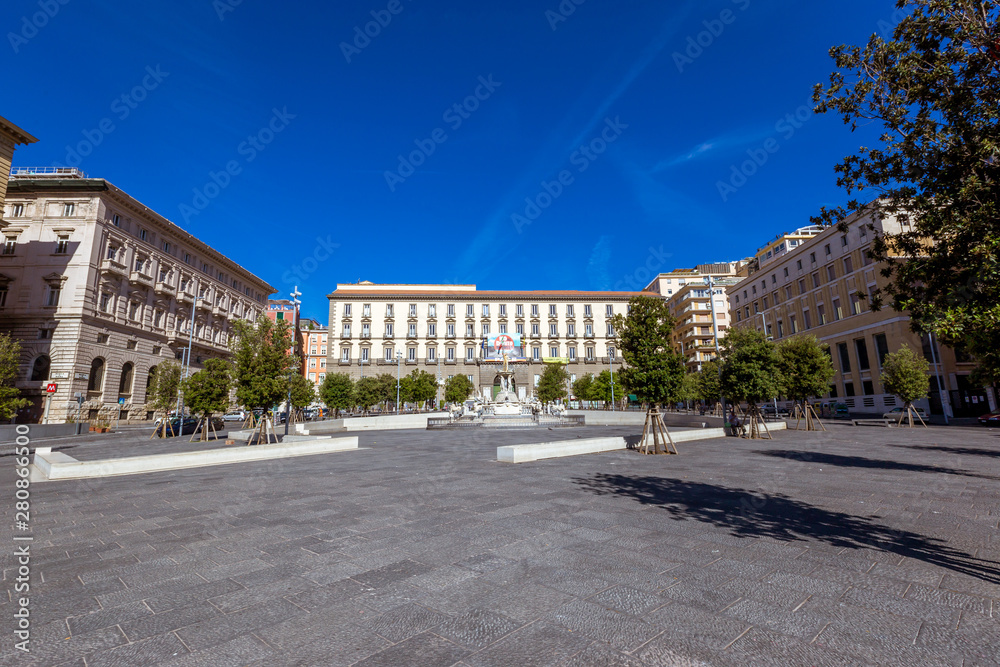 City Hall Square with the famous Neptune fountain on Piazza Municipio in Naples, Italy.