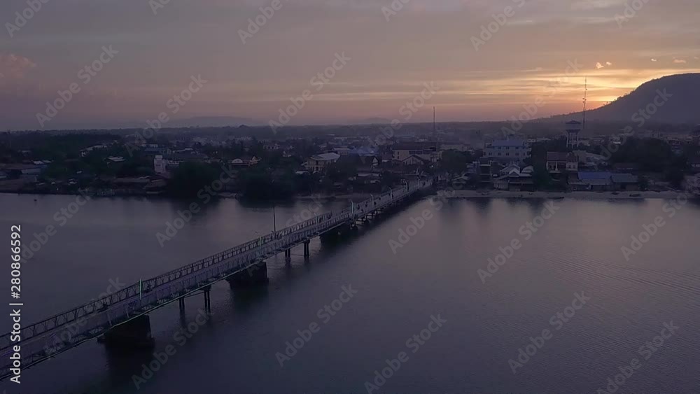 Aerial Shot of the Entanou Bridge and mountains on the Praek Tuek Chhu River in Kampot, Cambodia. Aerial Shot of the Entanou Bridge and mountains on the Praek Tuek Chhu River in Kampot, Cambodia.