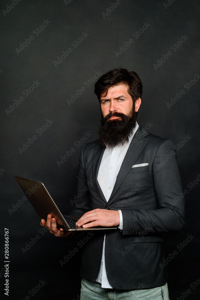 Virtual web chat. Technology, networking and internet concept. Businessman having conference in internet via notebook. Businessman making video calling using computer. Bearded man working on laptop. Virtual web chat. Technology, networking and internet concept. Businessman having conference in internet via notebook. Businessman making video calling using computer. Bearded man working on laptop.