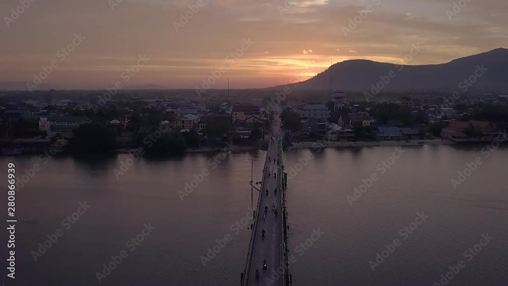 Aerial Shot of the Entanou Bridge and mountains on the Praek Tuek Chhu River in Kampot, Cambodia. Aerial Shot of the Entanou Bridge and mountains on the Praek Tuek Chhu River in Kampot, Cambodia.