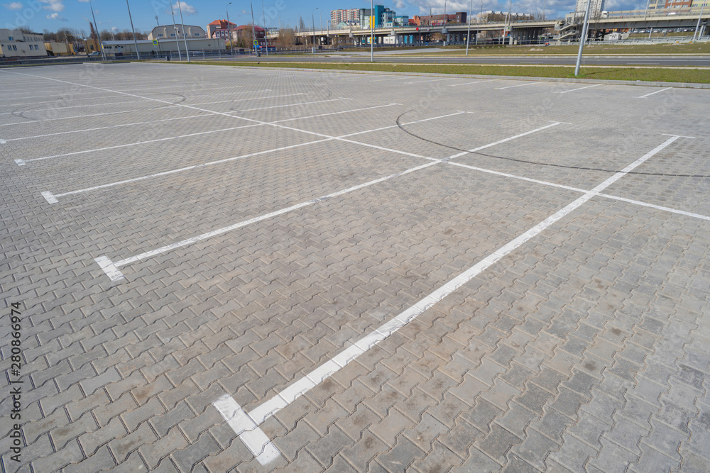 Fototapeta premium Open space with road signs and road markings, road intersections, pedestrian crossings, sunny day, blue sky, city landscape background
